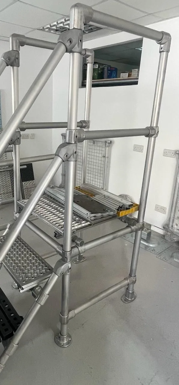 A stair and walkway with handrails for a solar installation