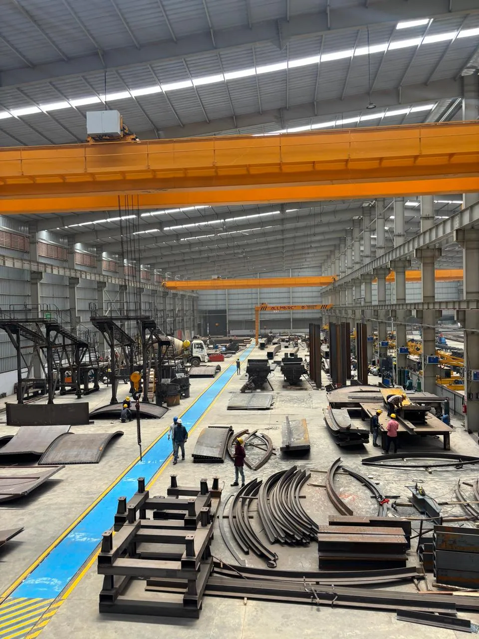 The fabrication bay under its overhead cranes